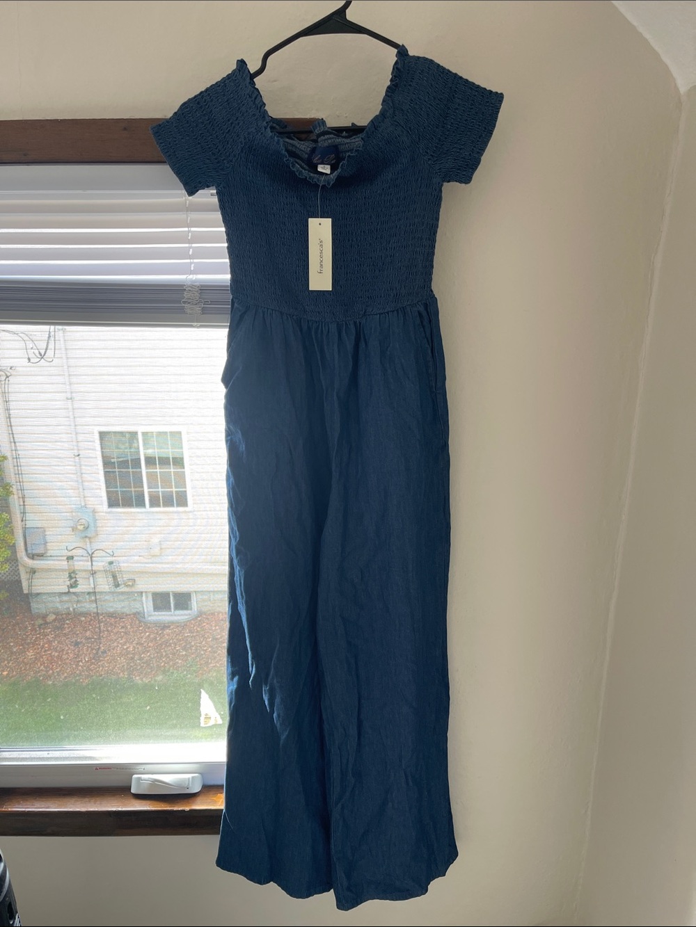 Blue Rain -Blue Smocked Wide-Leg Jumpsuit with pockets from Francesca’s